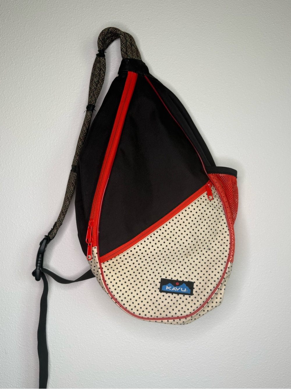 Kavu Backpack Black and Cream Polka Dot Sling Bag with Red Accents